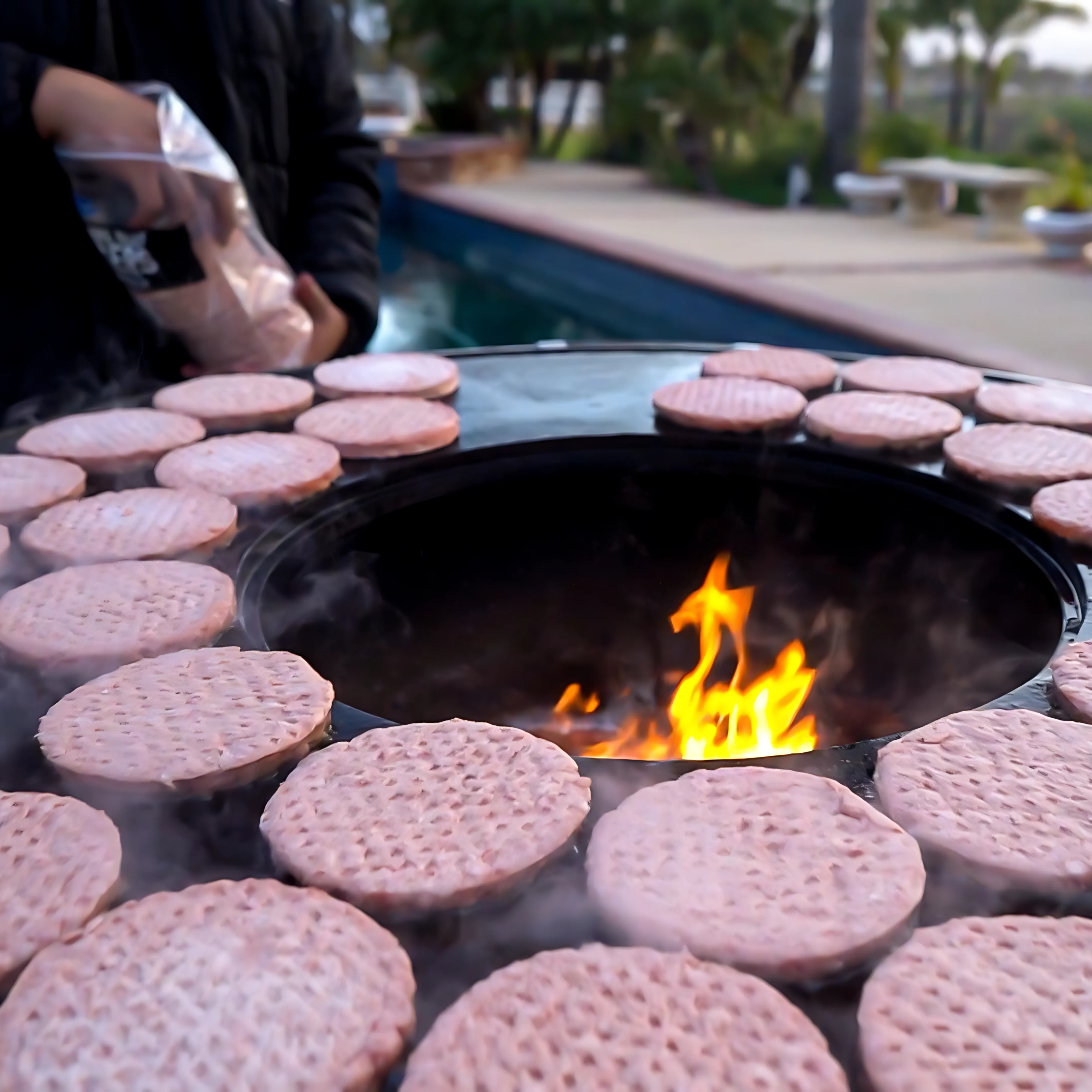 The Outdoor Plus Mojave Wood Burning Cast-iron Grill Metal Collection